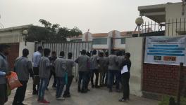 workers entering one of the manufacturing unit located in the Gurugram-Manesar industrial belt.