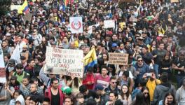 Thousands of Colombians participating in a strike on December 4 against the rise in assassinations of social leaders and the neoliberal economic measures. (Photo: Colombia Informa)