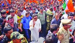 MNS chief Raj Thackeray waves as he joins party workers in the rally