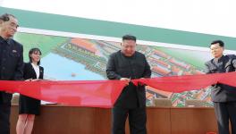 In this Friday, May 1, 2020, photo provided by the North Korean government, North Korean leader Kim Jong Un, center, cuts a tape, watched by his sister Kim Yo Jong, during his visit to a fertilizer factory in Sunchon, South Pyongan province, near Pyongyang, North Korea.