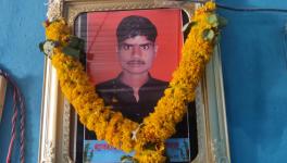 Garlanded photo of Chetan Alhat