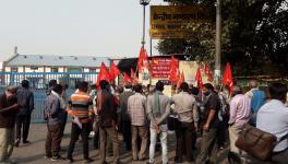 The contractual loading staff, accompanied by union members, standing outside CWC’s ICD at Patparganj in East Delhi.