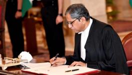 CJI NV Ramana signs the register after being sworn in as CJI in Rashtrapati Bhavan.