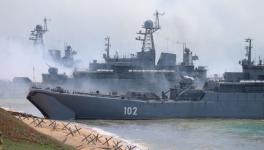 Russian military’s armoured vehicles roll into landing vessels after drill in Crimea, Black Sea, April 23, 2021