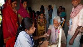 Free health check up being done at a village under National Rural Health Mission (2013) programme.