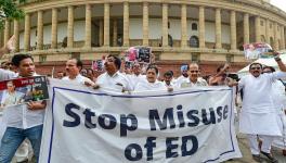 Congress MPs holding banner and placards stage a protest march at Parliament House complex to express their solidarity with the party Chief Sonia Gandhi who has to appear before the Enforcement Directorate in connection with the National Herald case, in New Delhi, July 21, 2022. 