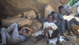 Workers at a stone quarry in Baramulla take a moment to rest, shelter against the scorching summer heat (Photo - Suhail Khan, 101Reporters).