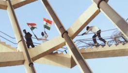 Students climb onto a tank in Hanumangarh town with flags (Photo sourced by Amarpal Singh Verma).