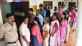 Kottayam: Voters wait in a queue to cast their votes during the by-elections to Puthuppally assembly seat, in Kerala's Kottayam district, Tuesday, Sept. 5, 2023. (PTI Photo)(