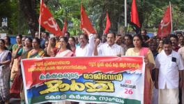 Kerala Karshaka Sangham state president M Vijayakumar and other office-bearers march towards the Kerala Raj Bhavan. 