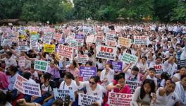 People from the Meitei community raise slogans during their protest at Jantar Mantar in New Delhi, Sunday, June 4, 2023.