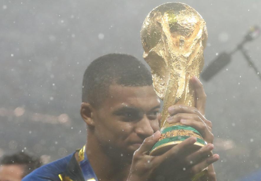 Kylian Mbappe with the FIFA World Cup