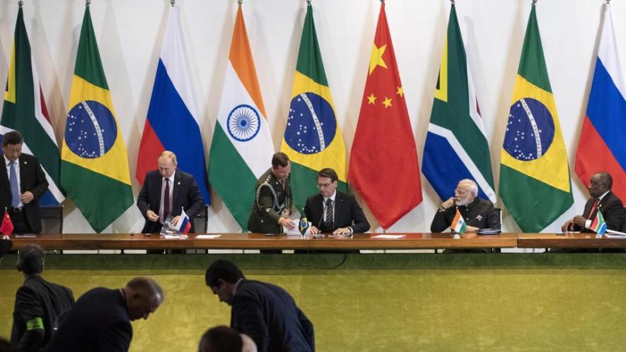 China's President Xi Jinping, left, Russia's President Vladimir Putin, second from left, Brazil's President Jair Bolsonaro, center, India's Prime Minister Narendra Modi, second from right, and South Africa's President Cyril Ramaphosa leave after a meeting during the BRICS emerging economies, Brasilia, Brazil