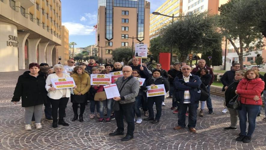 Workers of the Coty-Lancaster House in Monaco strike against proposed job cuts. 