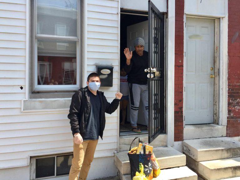 Philadelphia Liberation Center volunteer poses with a neighbor after distribution. Photo: Philadelphia Liberation Center