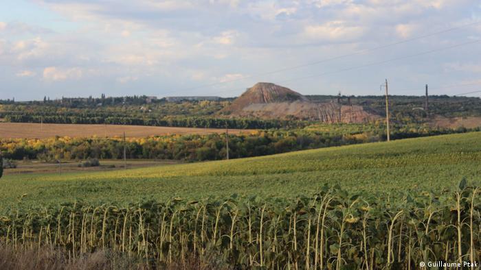 Mine tailings near the city of Zolote are visible from a distance