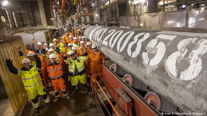 Workers celebrate the completion of Nord Stream 2 in September 2021