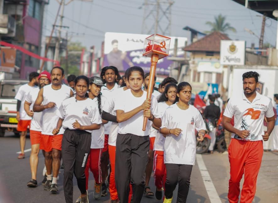 Athletes carry Flag in a procession to the Party Congress venue