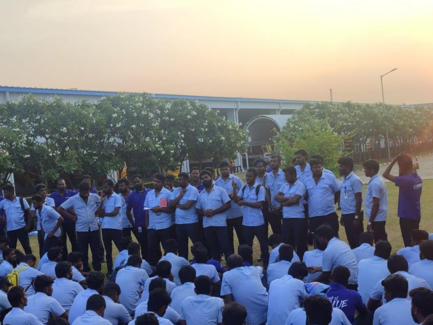 Workers of the Yamaha Motors holding protest sit in protest against the anti labour policies of the management.