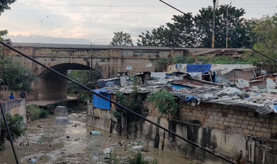 The railway tracks at Pulakeshinagar (pictured behind the slum)