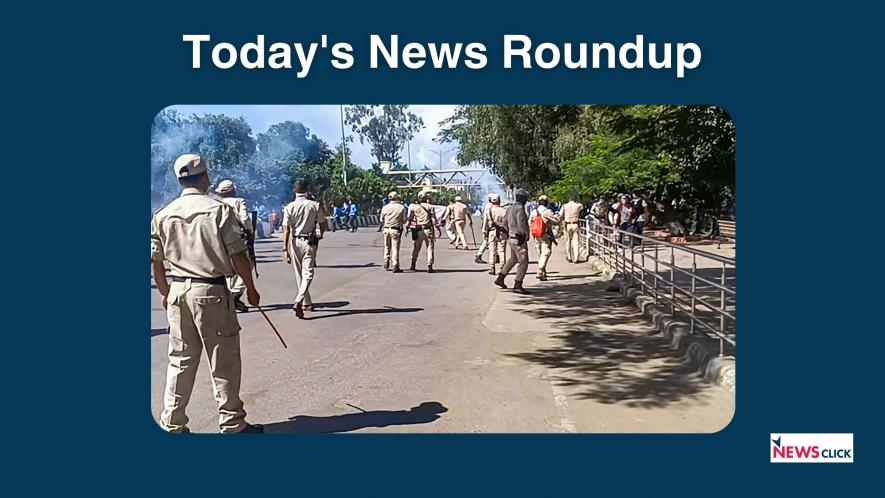 Security personnel stand guard during a protest against the killing of two youths who were allegedly kidnapped in July, in Imphal, Tuesday, Sept. 26, 2023. 