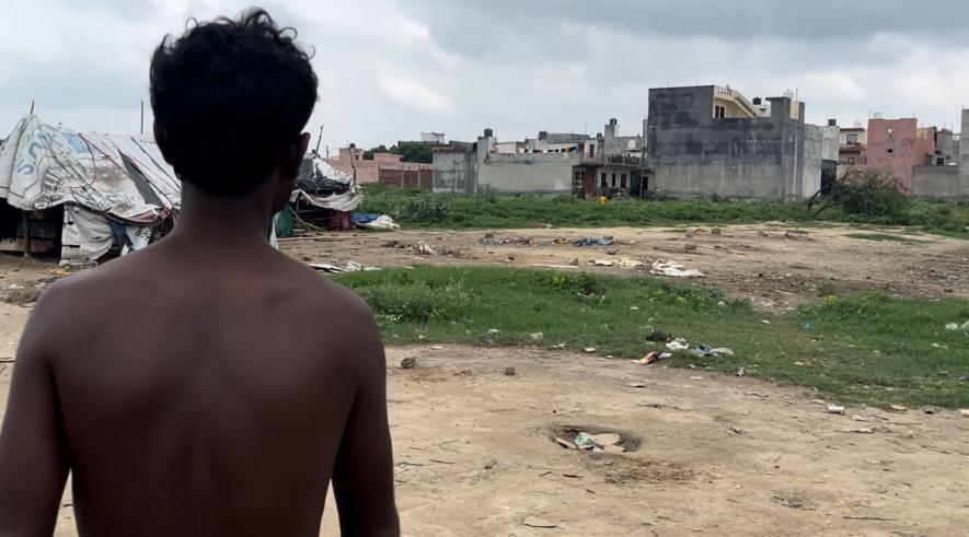 Arun, a resident in the slum near Galdhar Railway Station Ghaziabad, showing the spot of the violence 