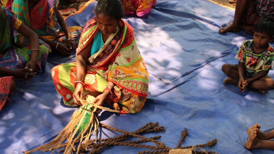 A woman in Dengam village showing how to make ropes and other household things from siali barks (Photo - Rakhi Ghosh, 101Reporters)